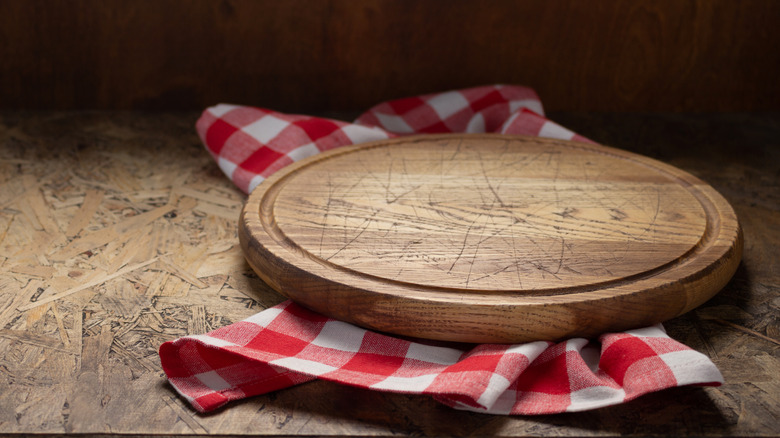 Round cutting board and checkered rag