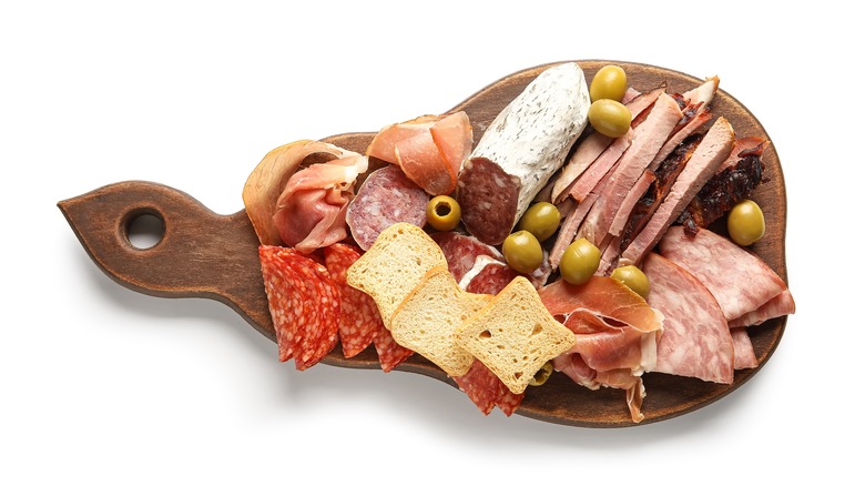 Deli meats on wooden board