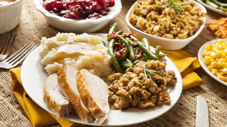 plate filled with traditional thanksgiving foods