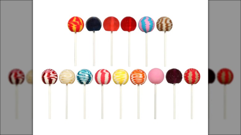 two rows of colorful round lollipops