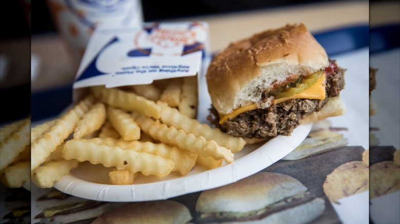 Slider burger and crinkle fries on plate at White Castle