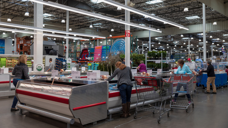 Costco shoppers in aisles