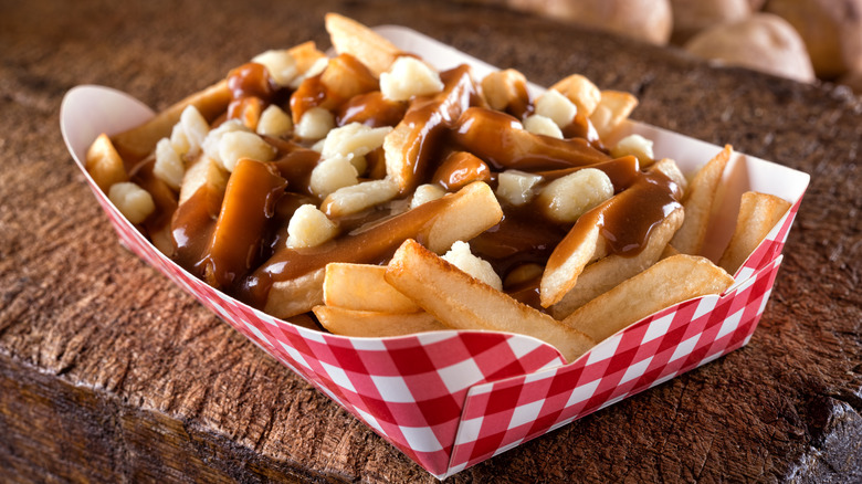 Takeout box of poutine