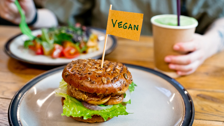 Burger on plate with vegan label