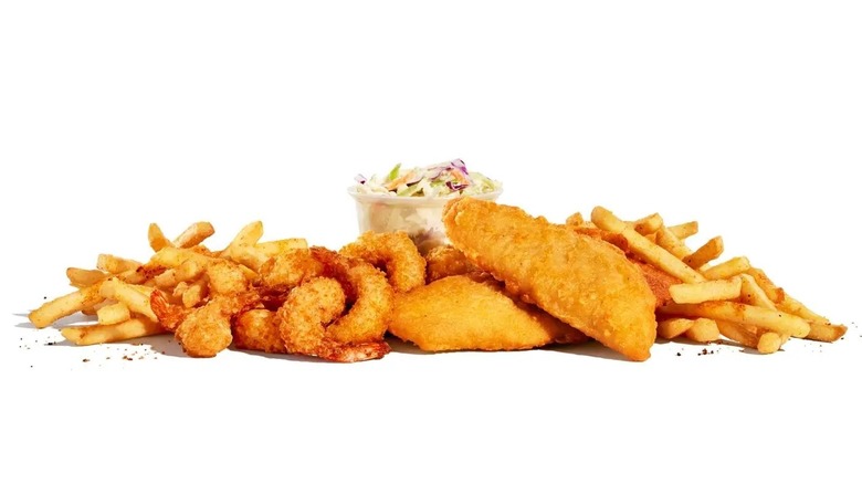 Fries, breaded shrimp, fried fish, and coleslaw