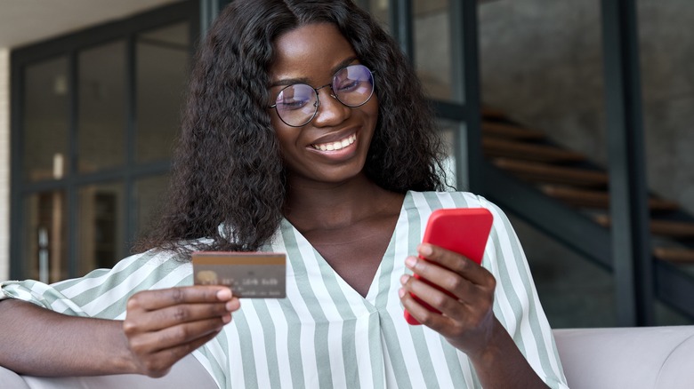 Woman buying gifts on phone