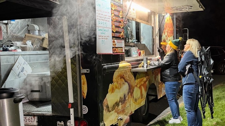 Customers at Macken's Sliders food truck at night