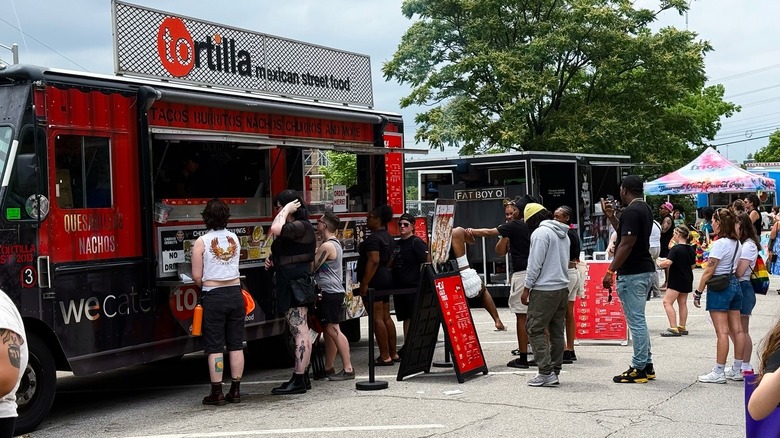 Customers line up outside Tortilla Street Food truck