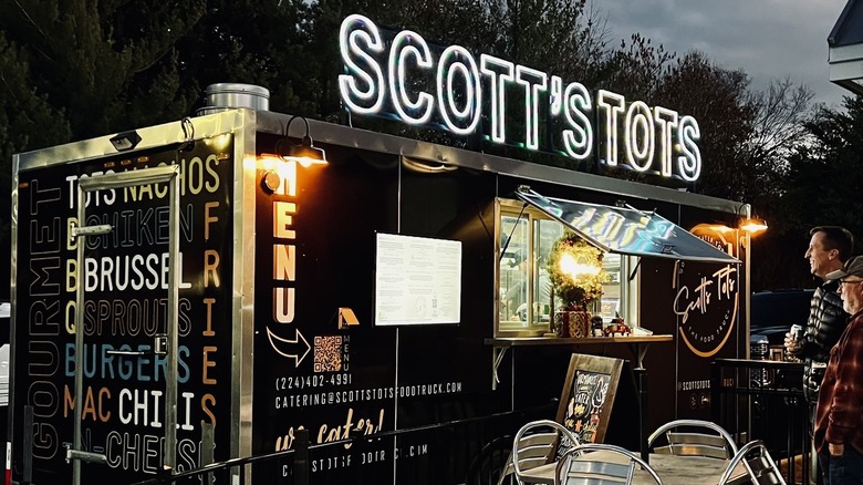 Scott's Tots Food Truck lit up in the evening
