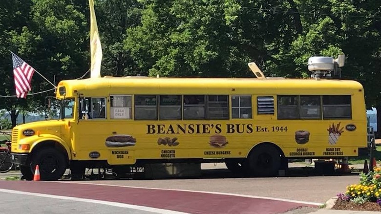 A yellow school bus labeled Beansie's Bus food truck