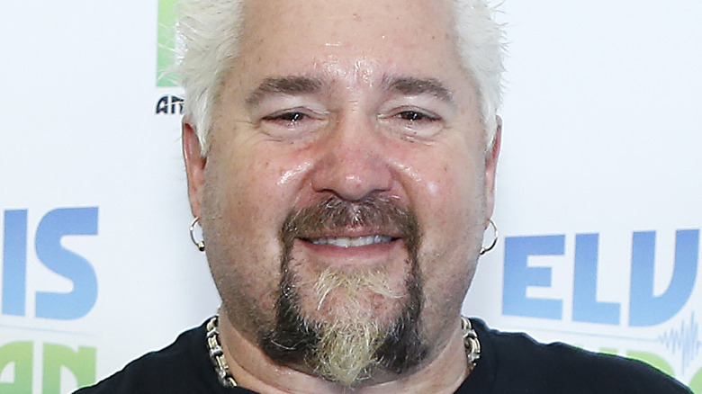 Guy Fieri in a black t-shirt