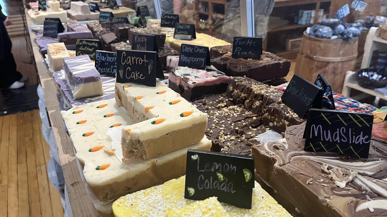 Assorted fudge including flavors like lemon colada, mudslide, carrot cake, raspberry and more