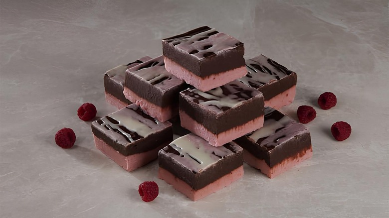 Stack of Dark Chocolate Raspberry Truffle Fudge from Bear City Fudge Company on dark surface