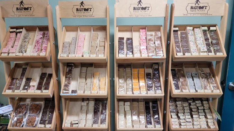 Four shelving units with rows of assorted fudge at Bigfoot Fudge Factory