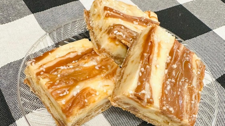 Three pieces of fudge on a glass plate