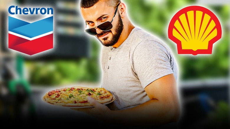 Man holding a pizza with gas station Chevron and shell logo