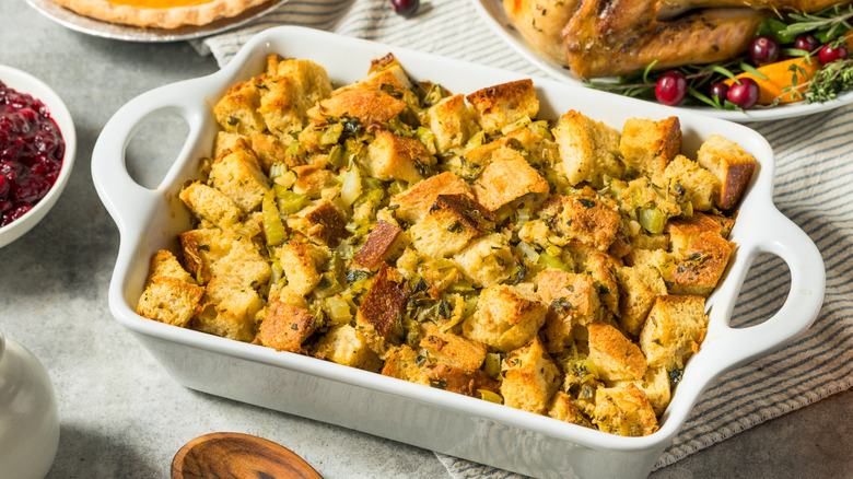 baking dish with stuffing on thanksgiving dinner table