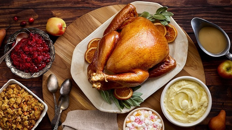 Thanksgiving turkey with mashed potatoes and assorted sides