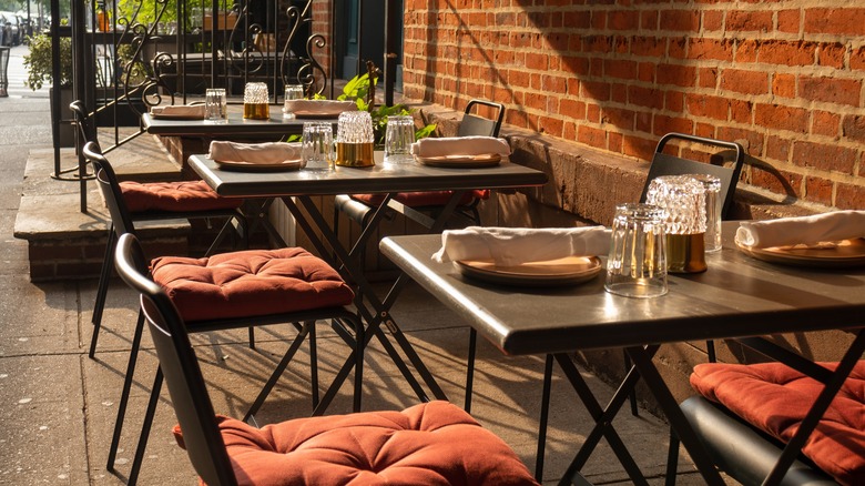Outdoor dining tables at an NYC cafe