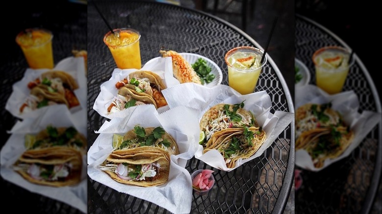 Tacos and drinks on table at Mas Tacos Por Favor