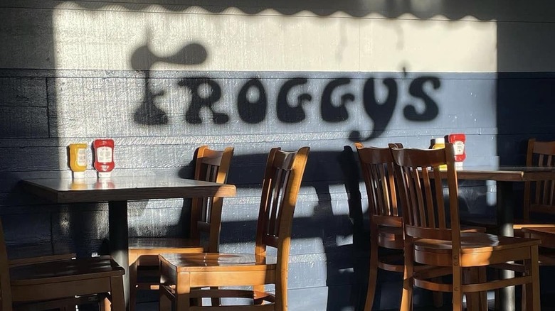 Shadow of Froggy's logo on interior wall
