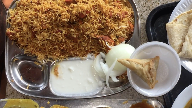 chicken biryani in metal tray