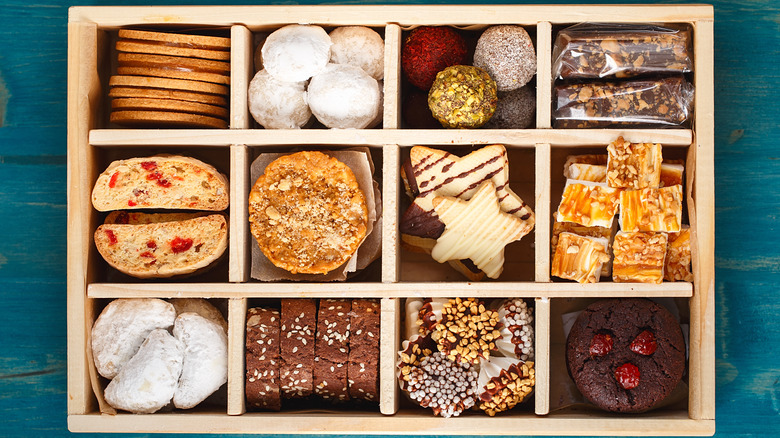 Wooden gift box of cookies and holiday treats.