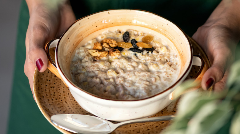 bowl of oatmeal held on plate