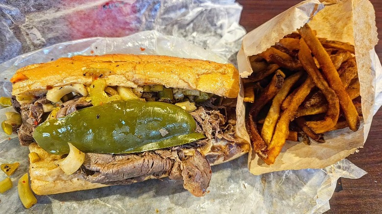 Italian beef sandwich with a side of fries at Mr. Beef