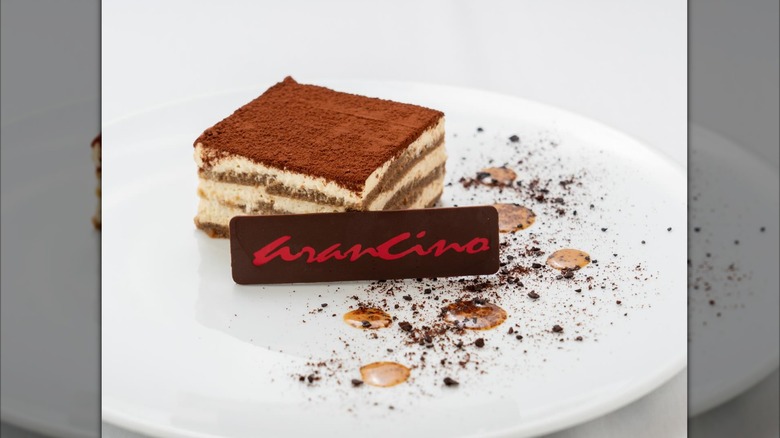 Tiramisu next to a chocolate that says Arancino