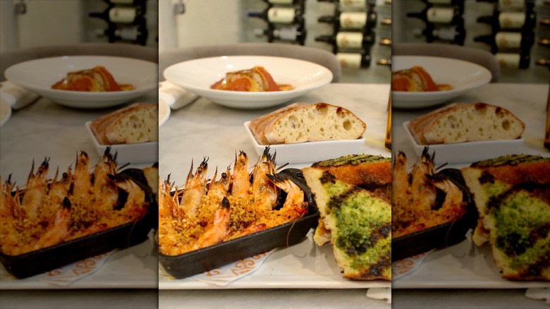 Shrimp in a dish next to bread