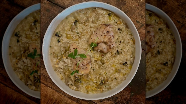 Risotto in a white bowl with meat