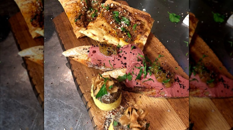 Rosemary flatbread, chicken liver crostini with green tomato marmalade, and semolina cakes
