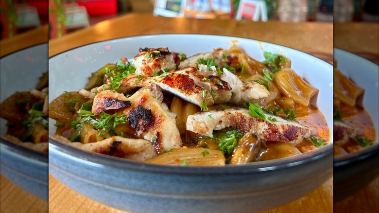A bowl of honey chipotle pasta with lemon butter caper sauce