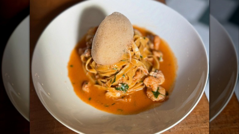 Tajarin with potted shrimp on a plate