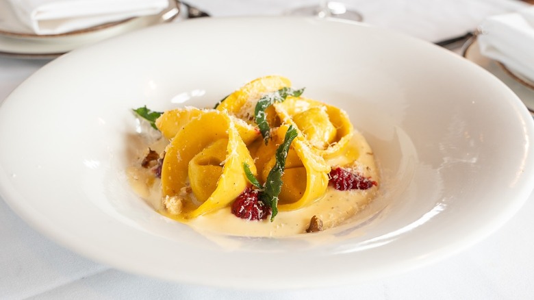 Tortelli with parmigiano cream and walnuts