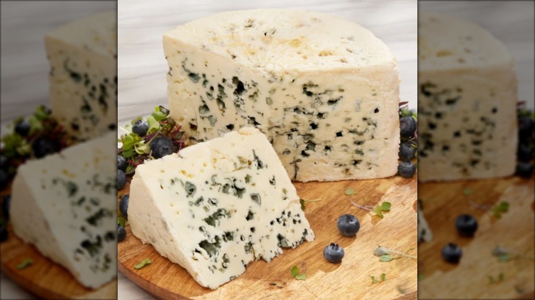 block of Roquefort cheese on cutting board