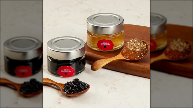 two varieties of balsamic pearls in spoons and jars