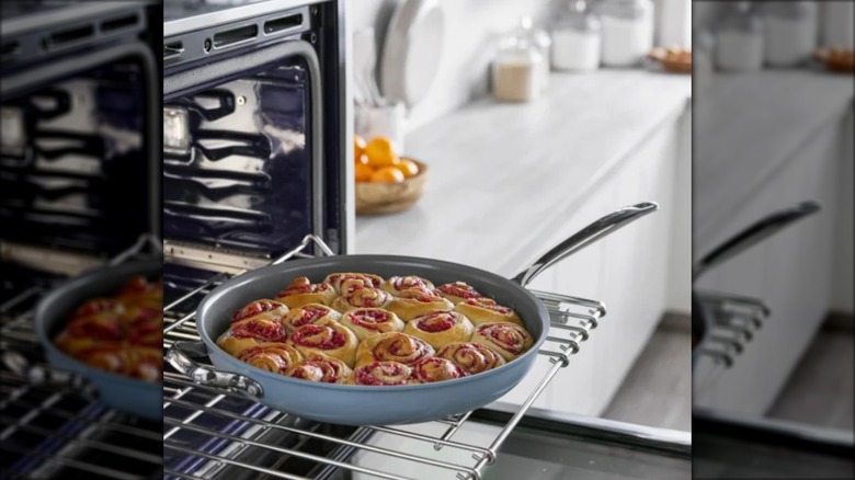 large pan with baked cinnamon rolls on oven rack