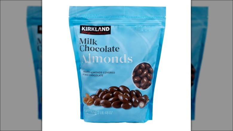 blue bag containing chocolate covered almonds