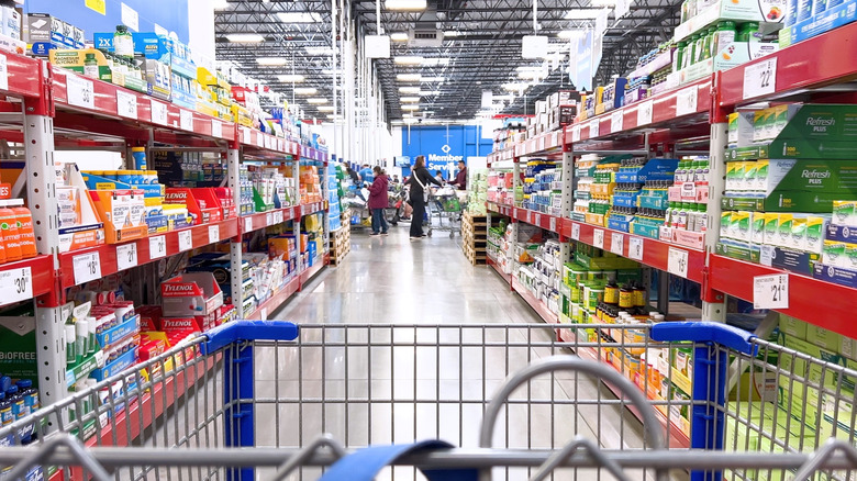 Point of view from a shopping cart inside the aisle of a Sam's Club store.
