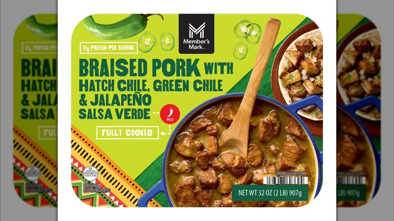 Prepared meal with braised pork, chili peppers, and salsa verde.