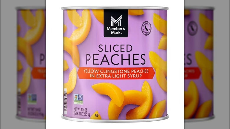 Container of sliced peaches in light syrup.