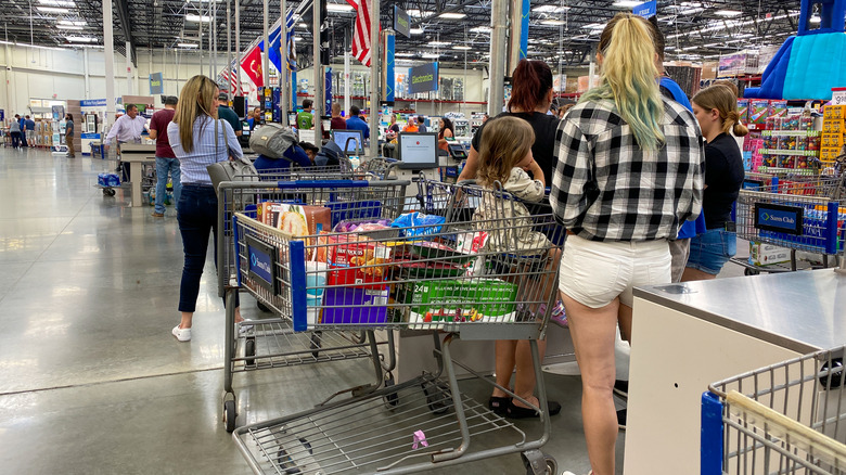 Customers waiting in checkout lines at Sam's Club in Orlando, Florida