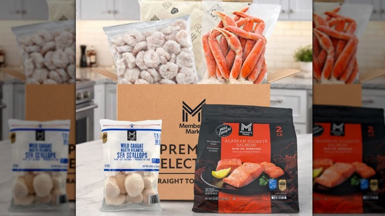 Sea scallops, Alaskan salmon, crab legs, and shrimp displayed on a counter