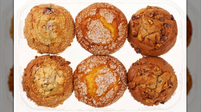 Six-pack of muffins in a plastic container.