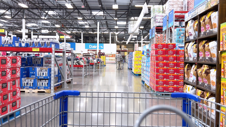 Sam's Club shopping cart in foreground and aisles in background