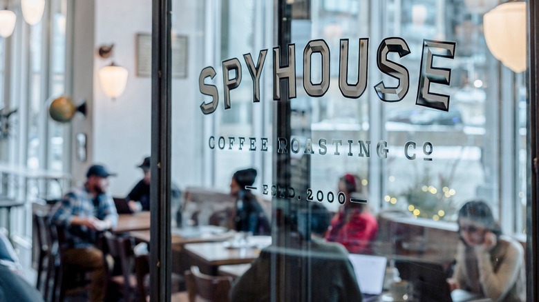 Glass door opens into the Spyhouse Coffee café