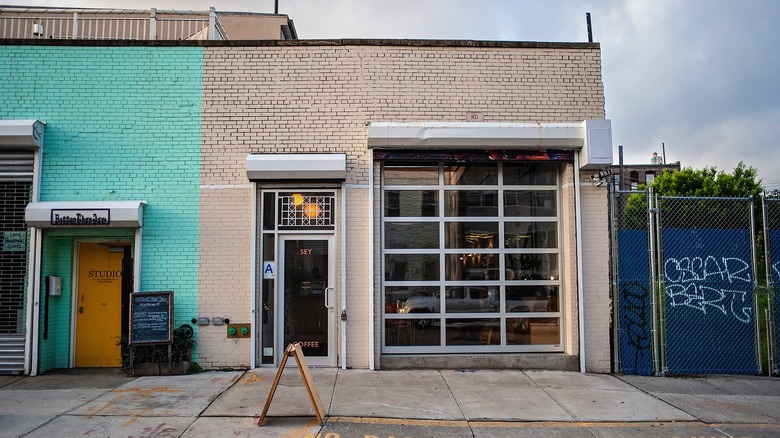 White brick facade of the SEY Coffee shop