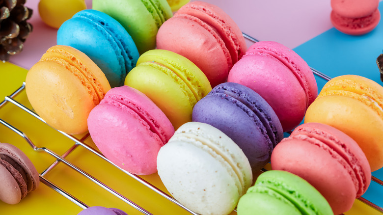 colorful macarons on drying rack